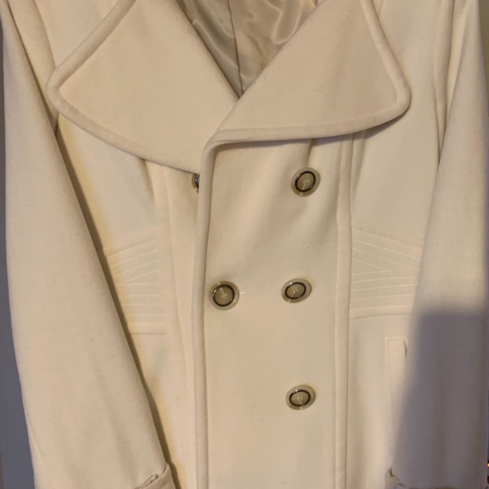 This coat is new with no tag , super cute , size 10 , cream color .